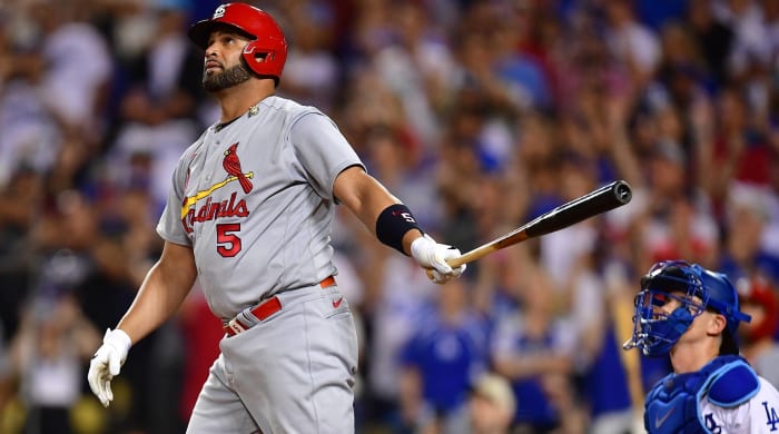 Albert Pujols stares in the air at the ball after hitting his 700th home run vs. the Los Angeles Dodgers.
